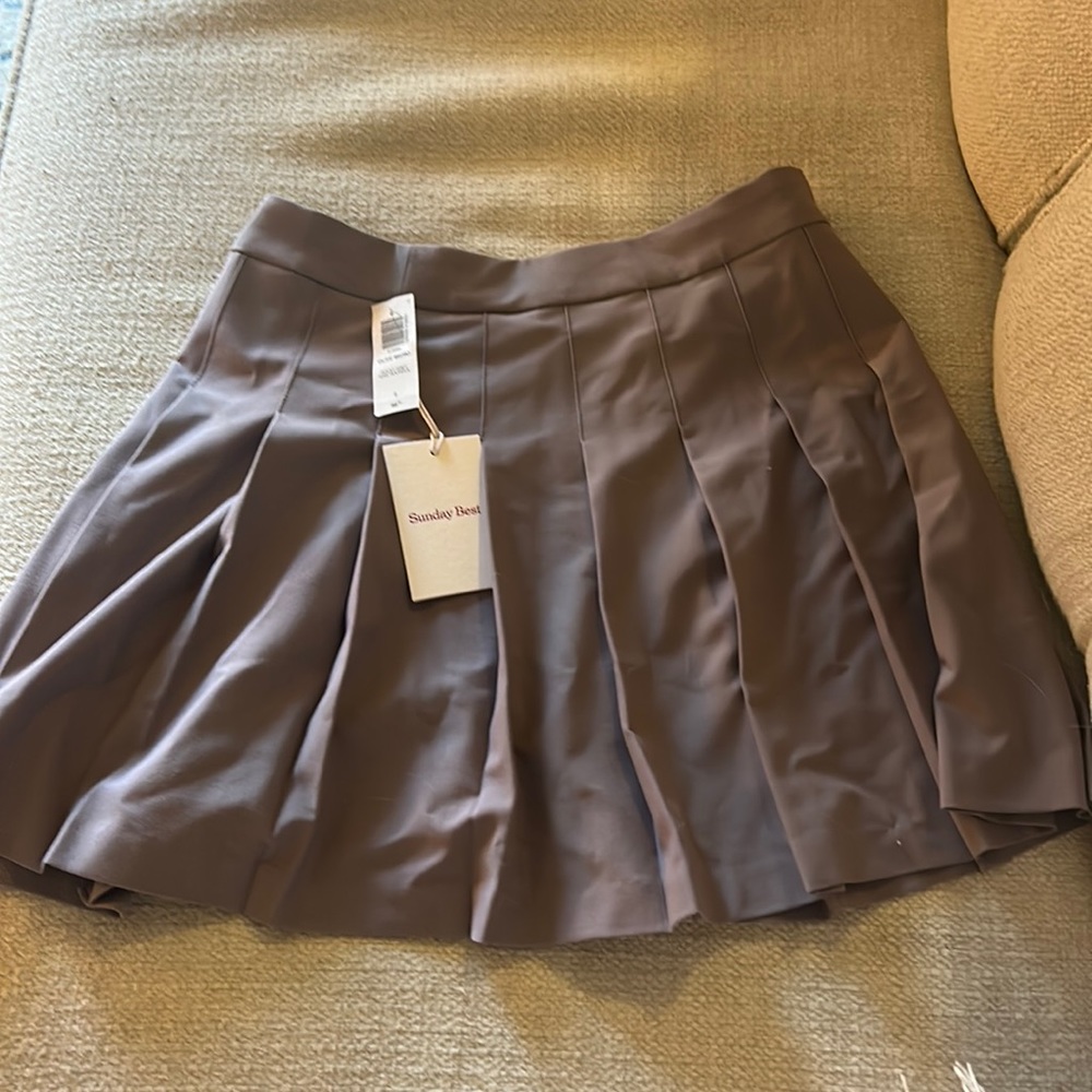 Sunday Best size 8 skirt titled “Olive Micro” and it is a rocky grey color.
